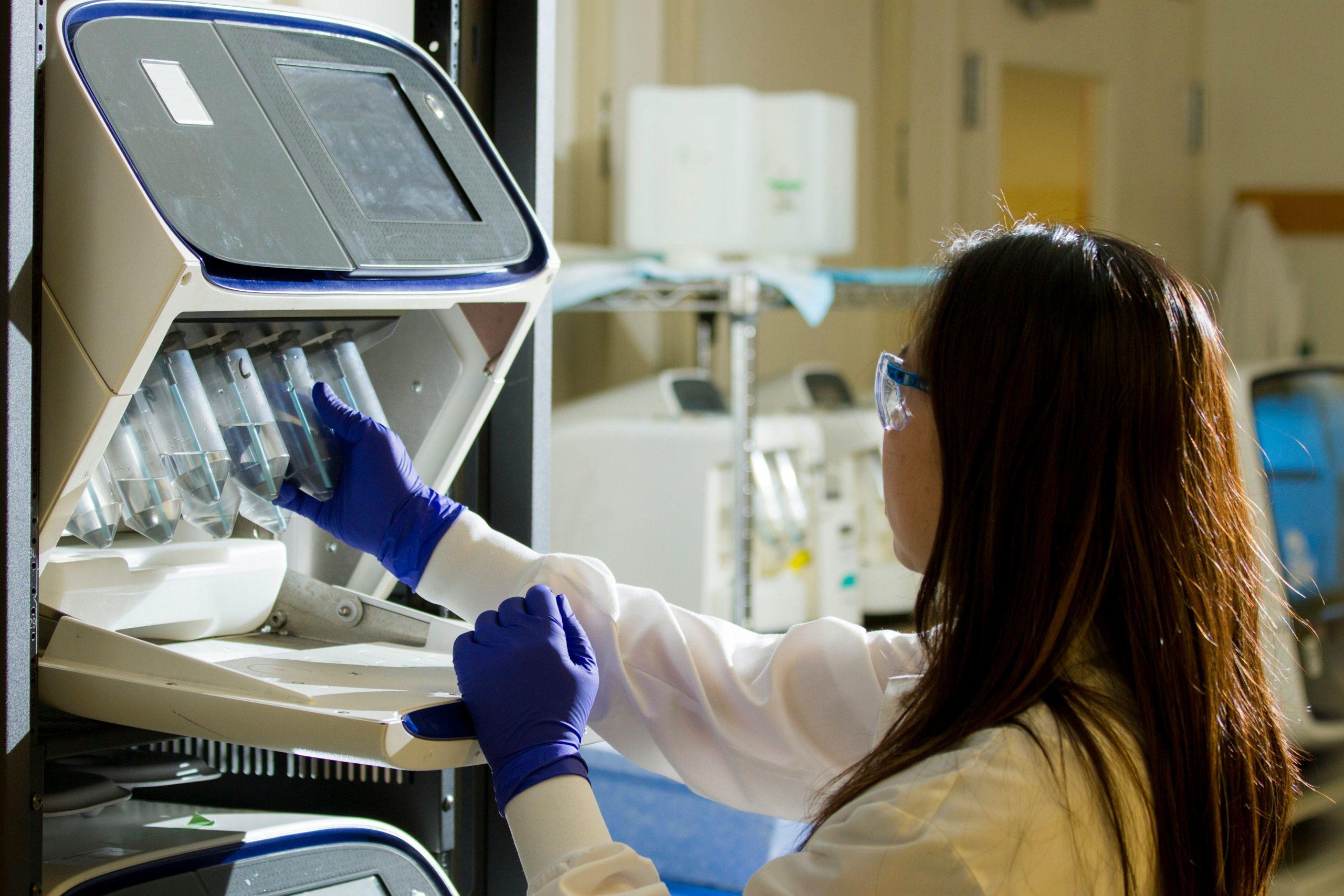 A researcher doing a biomedical study in a research and technology infrastructure.